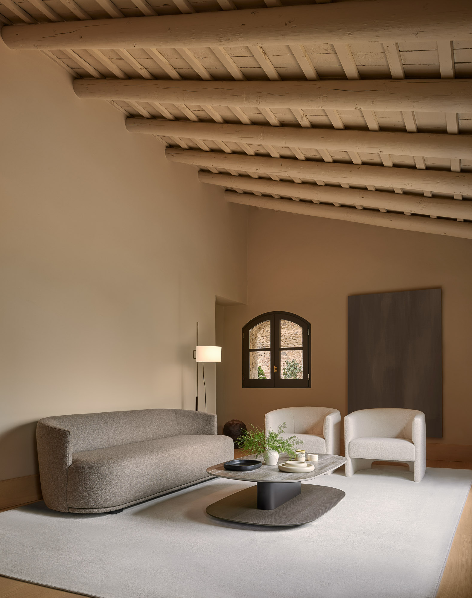 Flow straight sofa and loung chairs and sacha coffee table designed by Mario Ruiz for Joquer