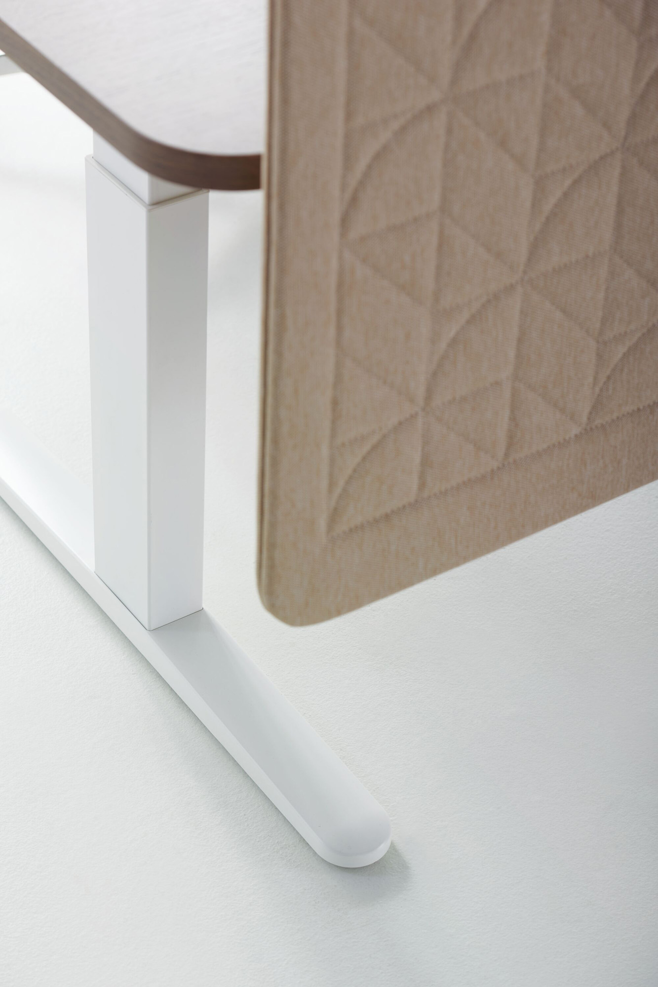 Emote height adjustable desk, part of the Emote private office collection by Mario Ruiz for Teknion