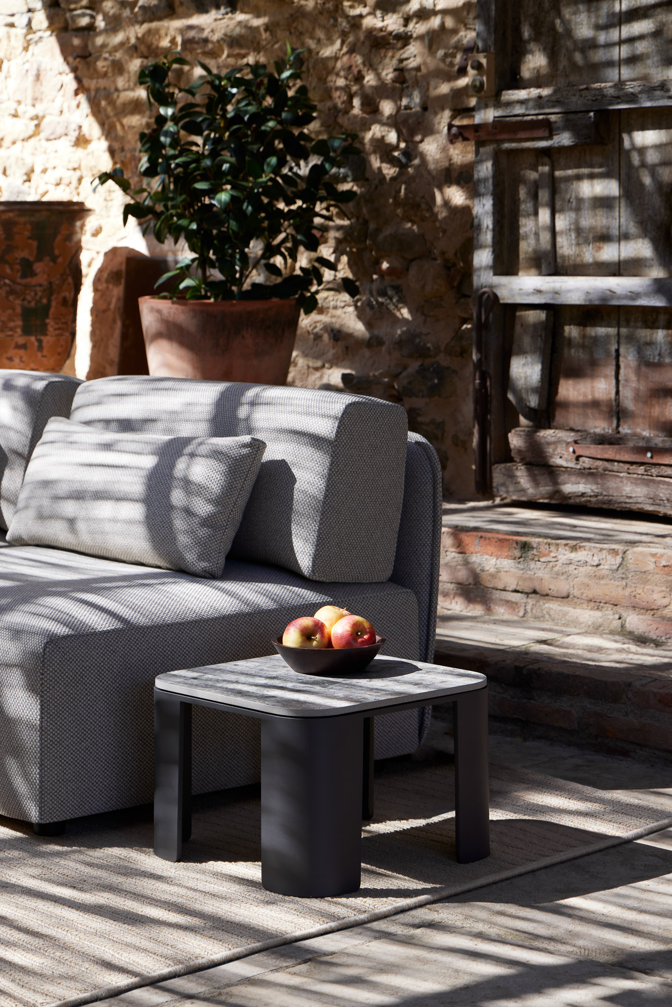 Bene outdoor tables and Serene Outdoor modular sofa designed by Mario Ruiz