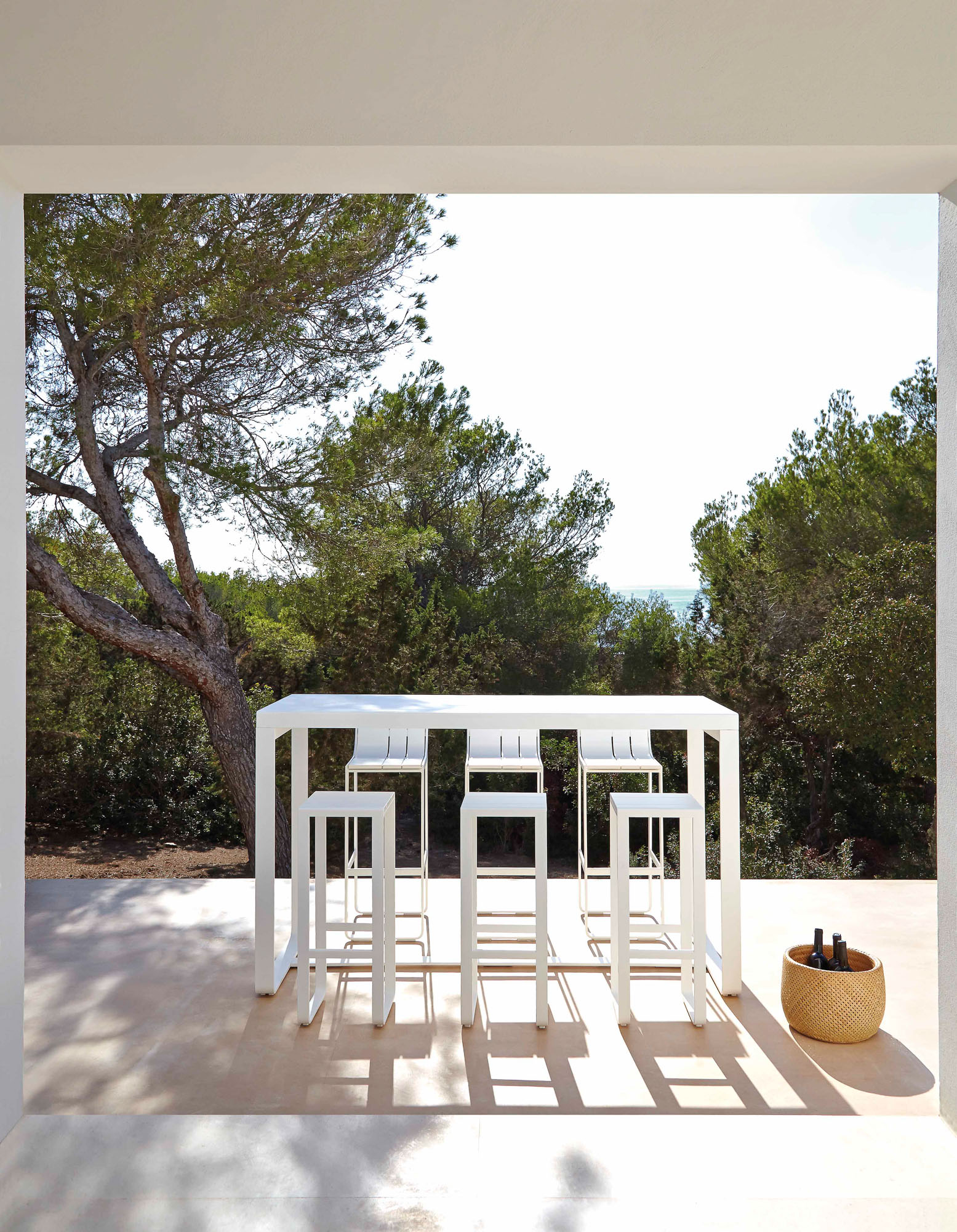 Flat bar table and stools designed by Mario Ruiz