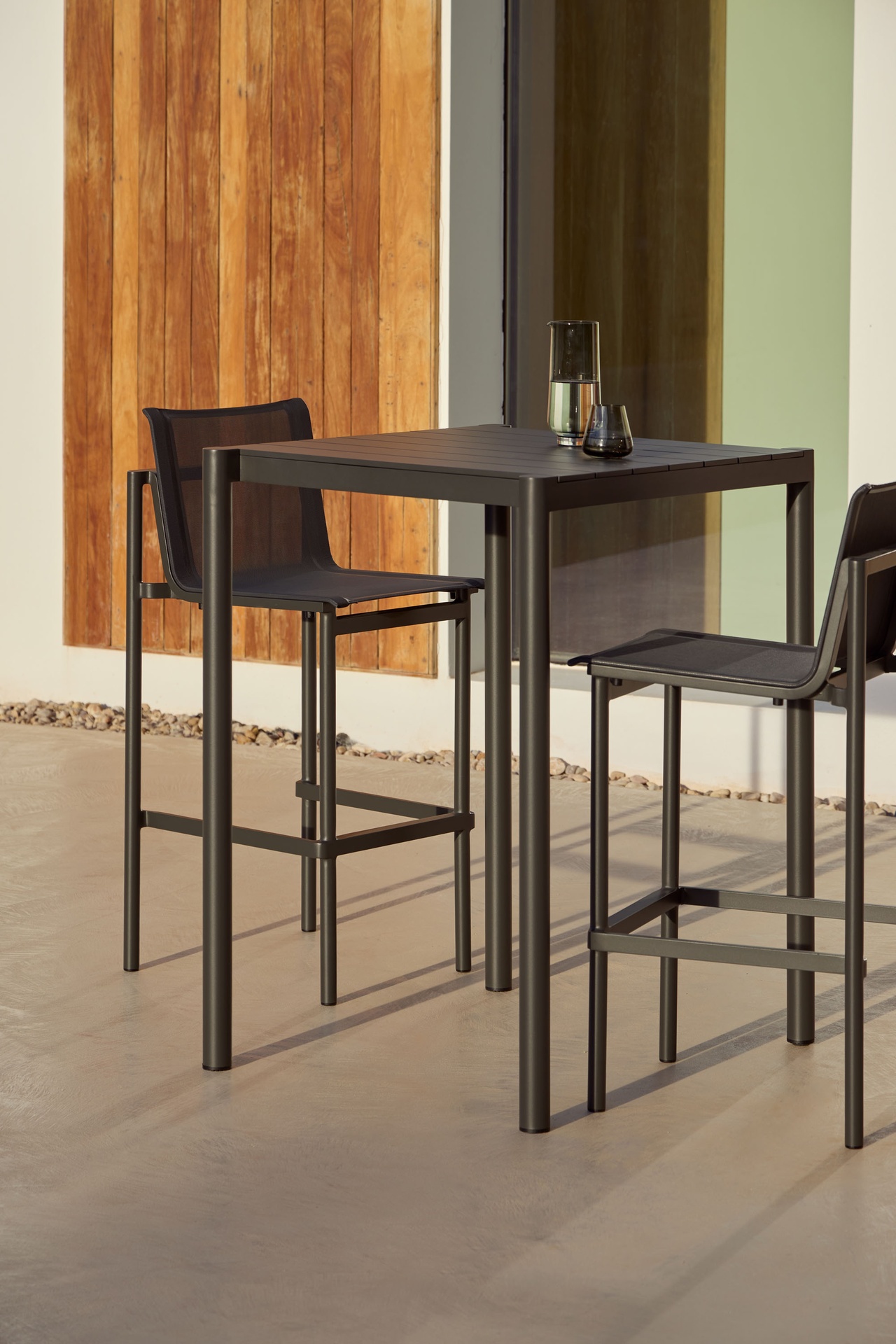 Origin outdoor high table and barstools designed by Mario Ruiz for Point