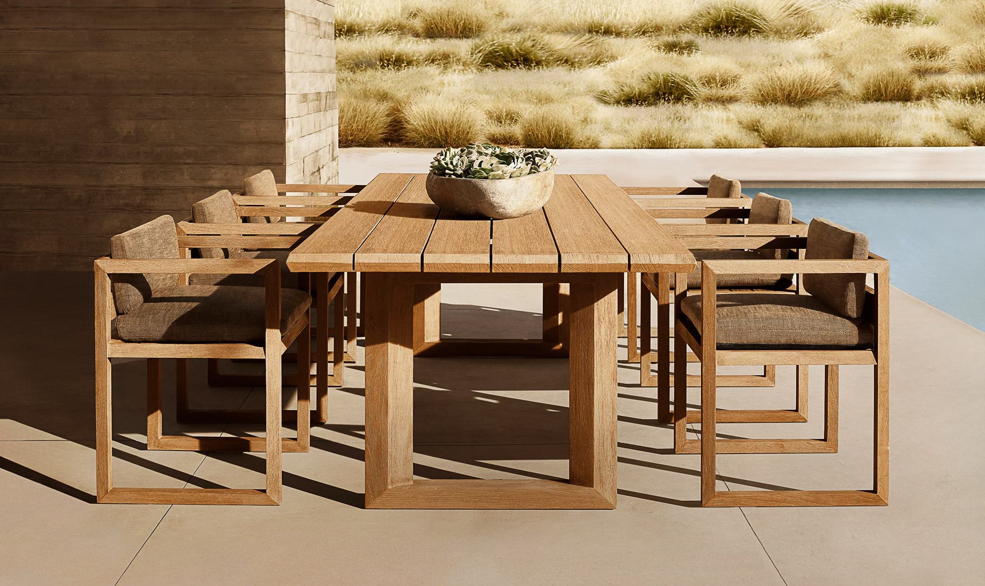 Paloma teak dining set designed by Mario Ruiz for RH